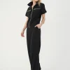 look coordonat cu set negru din jachetă cu guler înalt și pantaloni largi